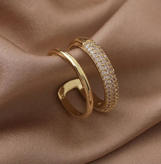 Lilyah Jewelry Gold Plated Zircon Diamond Ring. adjustable promise ring. accents of gold and diamonds.
Two layers to the ring, one gold plated band and the other has diamonds.