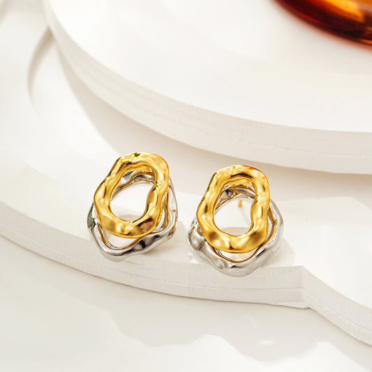 Lilyah Jewelry Gold Plated Earrings. Gold and silver earrings on a white surface