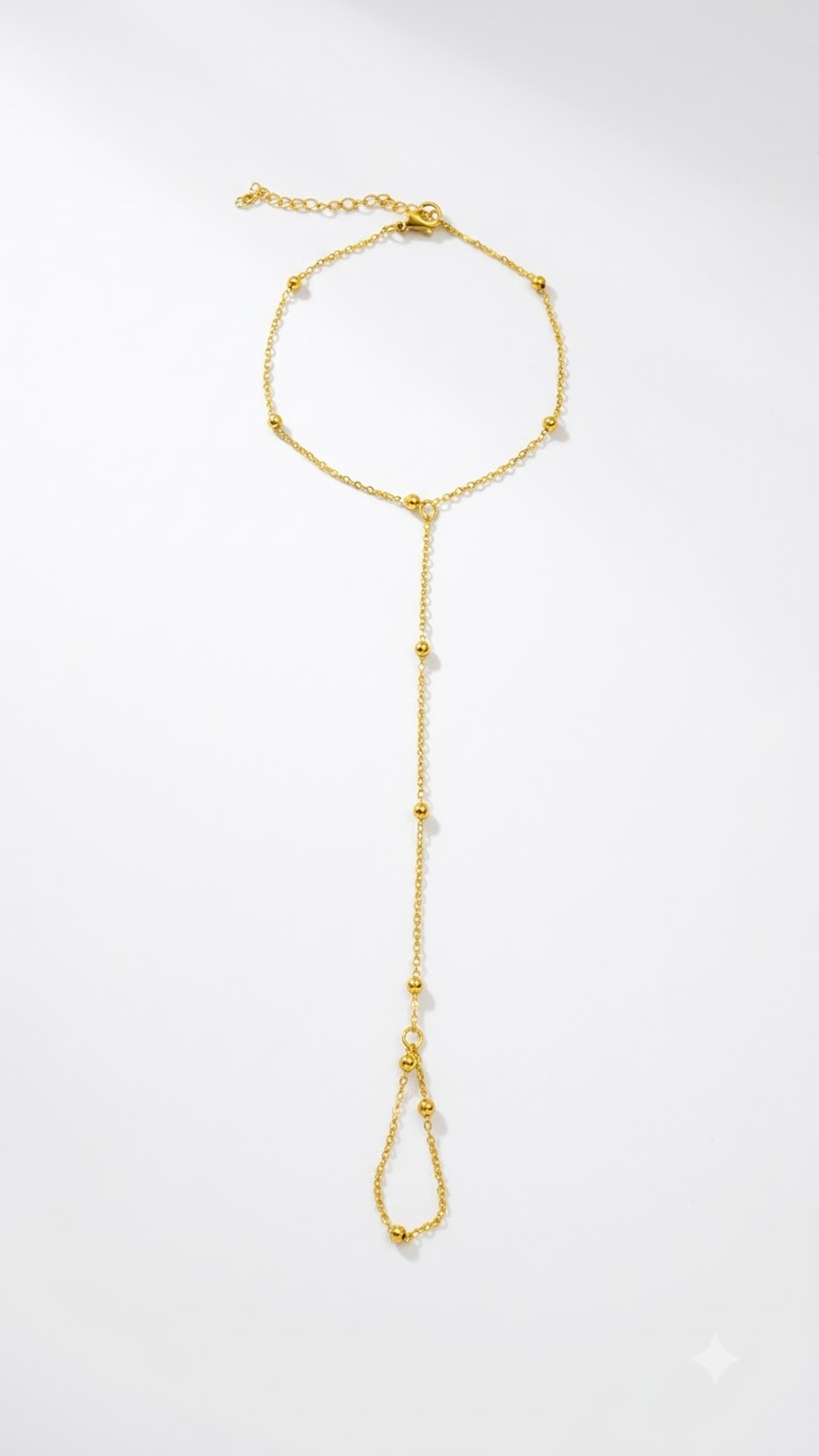 Lilyah Jewelry's delicate 18k gold plated bracelet cum ring with small gold bead accents, displayed on a clean white background.
