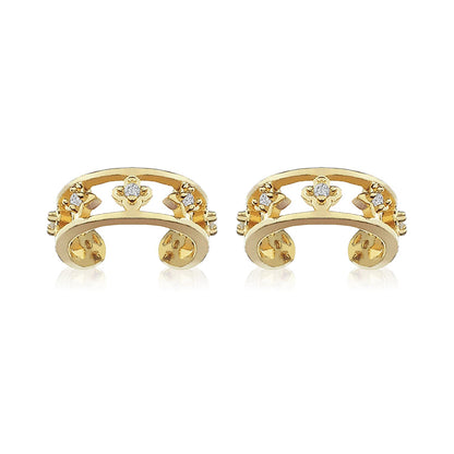 A pair of Lilyah Jewelry's 18k gold plated non piercing ear cuffs earrings with small clear gemstones displayed on a clean white background