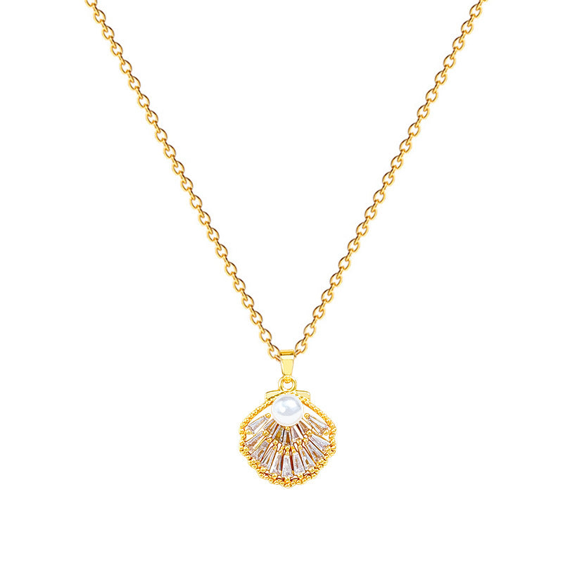 Lilyah Jewelry's 18k gold plated scallop-shaped pendant featuring a central white pearl and clear rhinestones, shown against a plain white background.