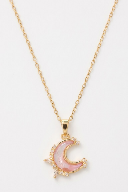 Lilyah Jewelry's 18k gold plated pink moon necklace on a lain white surface. it looks dreamy
