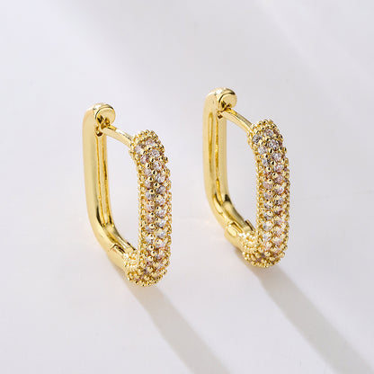 A pair of 18k gold plated rectangular hoop earrings with zircon inlays on a white background. Lilyah Jewelry Gold Plated Earring. Gift Ideas for her.