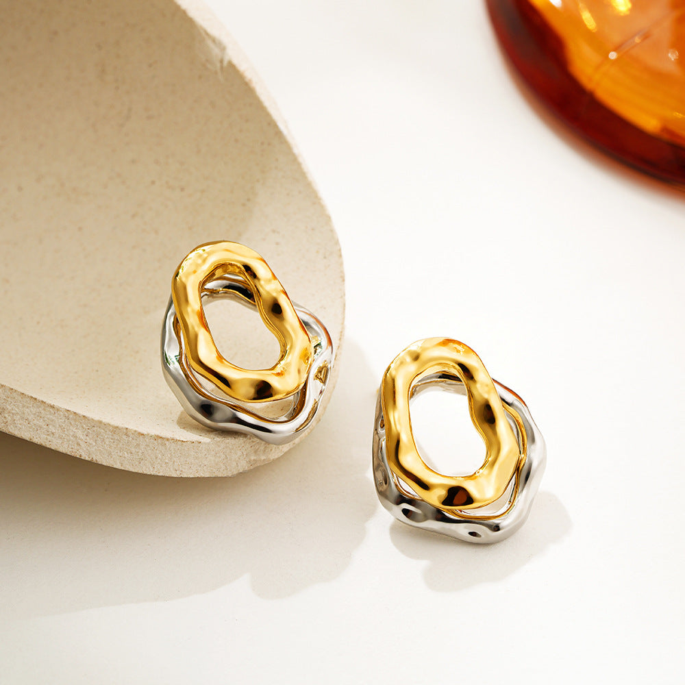 Lilyah Jewelry Gold Plated Earrings.  . Gold and silver earrings on a light background