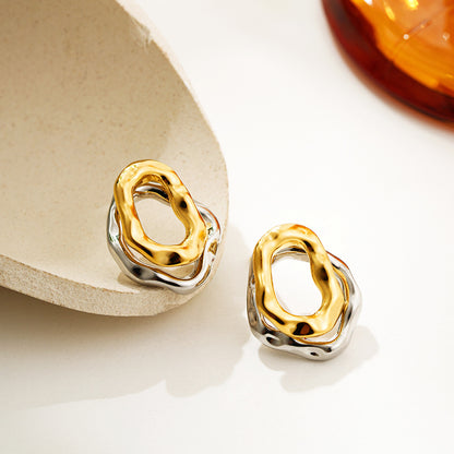 Lilyah Jewelry Gold Plated Earrings.  . Gold and silver earrings on a light background