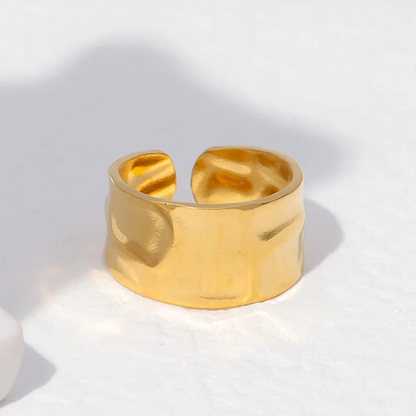 An 18k gold plated wide band textured open ring on a white background. Lilyah Jewelry Gold Plated Ring . Stunning, minimalistic, elegant and statement ring. Gift idea for her.
