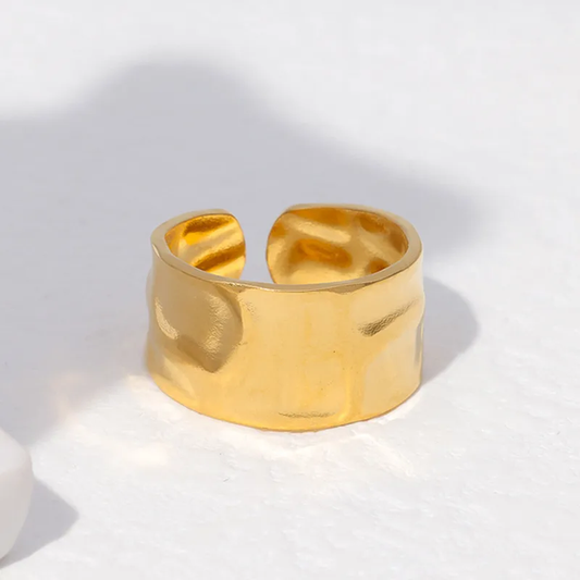 An 18k gold plated wide band textured open ring on a white background. Lilyah Jewelry Gold Plated Ring . Stunning, minimalistic, elegant and statement ring. Gift idea for her.
